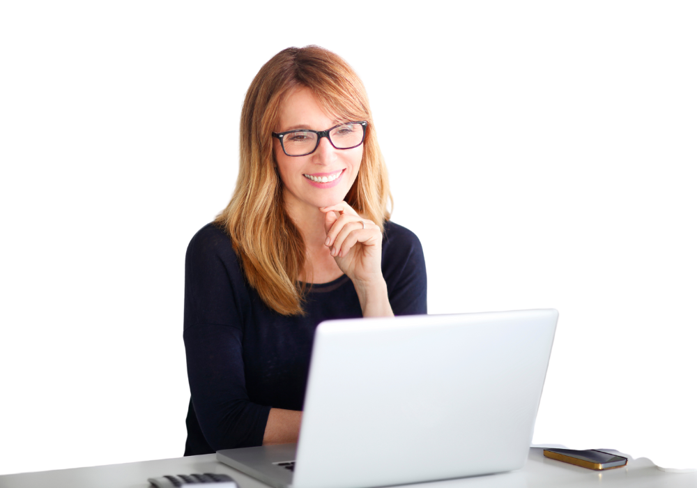 Girl behind a computer with a smile.